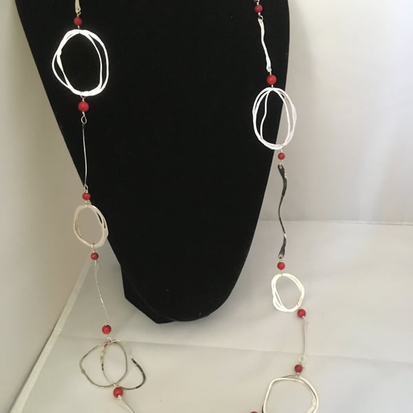 Contemporary long silver and coral necklace