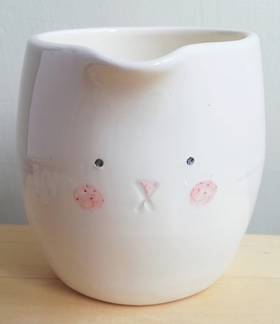 Ceramic handmade bunny jug handleless pourer with rabbit face and tail