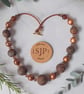 Conker brown, black and gold handmade polymer clay necklace - Image 3