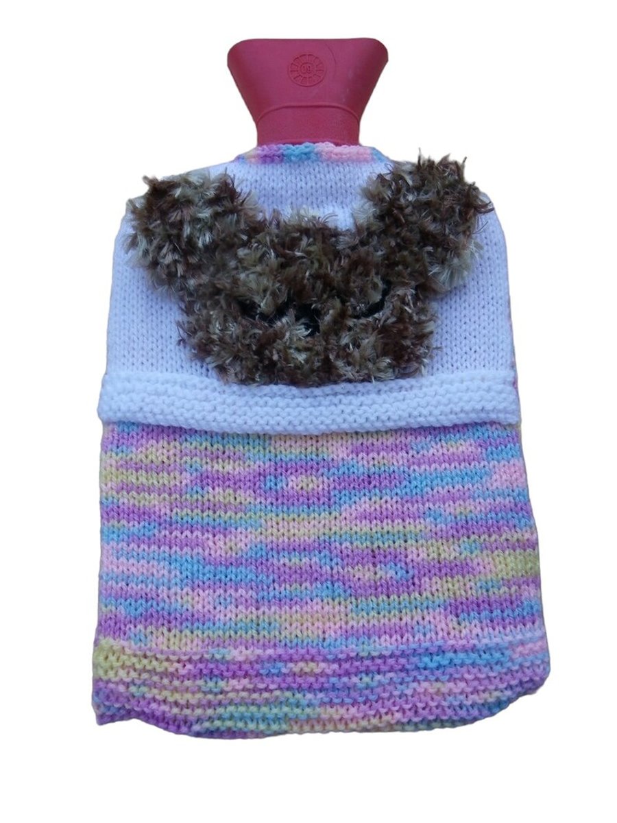 hot water bottle cover with a fluffy teddy in bed design 