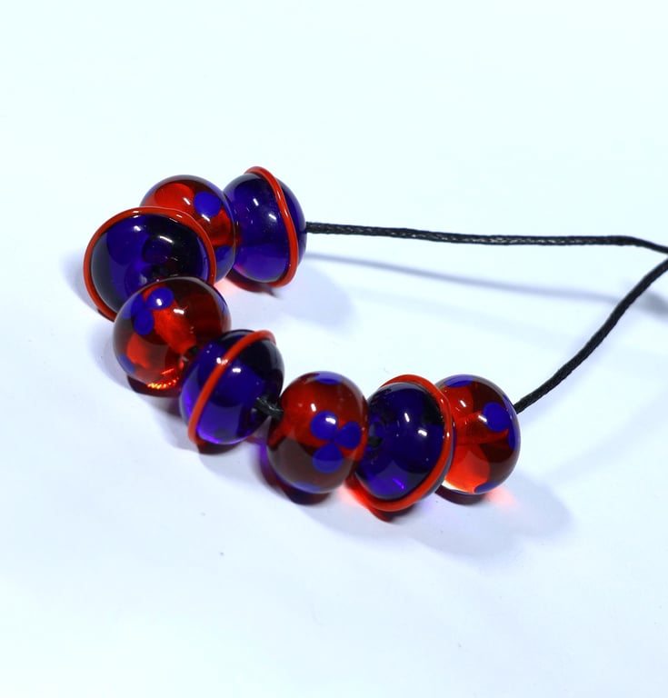 Handmade orange and blue lamp work glass beads