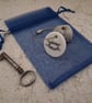 Pebble keyring with a knotted rope image - Image 1