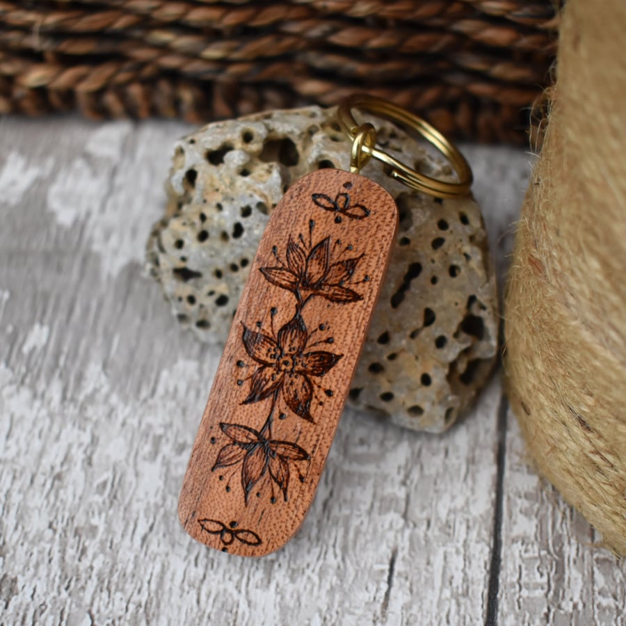 Tropical flower pyrography keyring on mahogany. Ideal wood gift, ready to post.