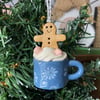Hanging decoration tiny gingerbread man in a mug