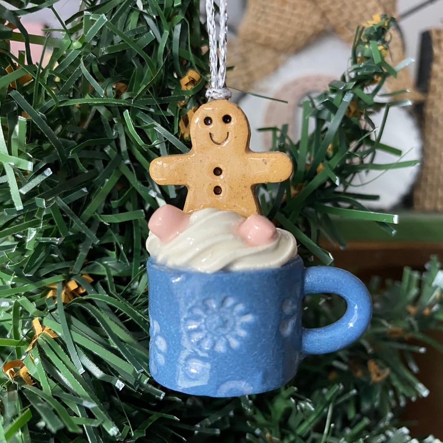 Hanging decoration tiny gingerbread man in a mug