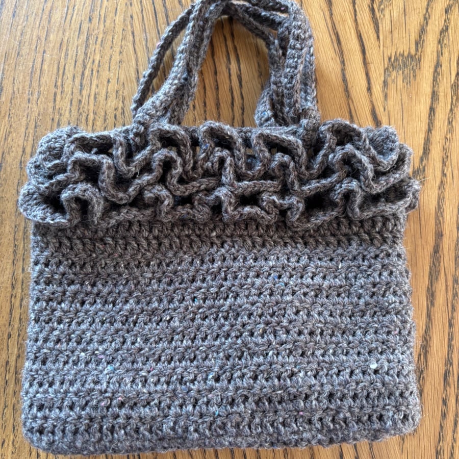 Hand bag - crocheted and fabric-lined using recycled materials 