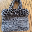 Hand bag - crocheted and fabric-lined using recycled materials 