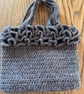 Hand bag - crocheted and fabric-lined using recycled materials 