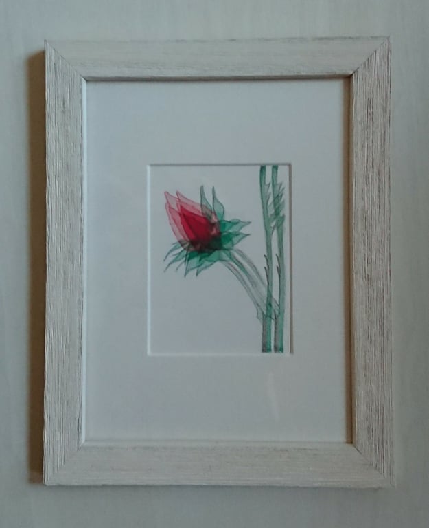 Single Red Rosebud art in small white frame, ready to hang