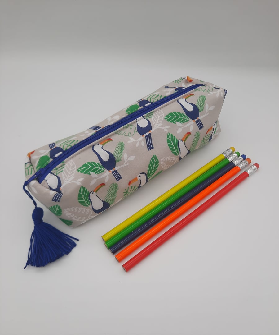 Toucan theme boxed pencil case with blue tassel. 