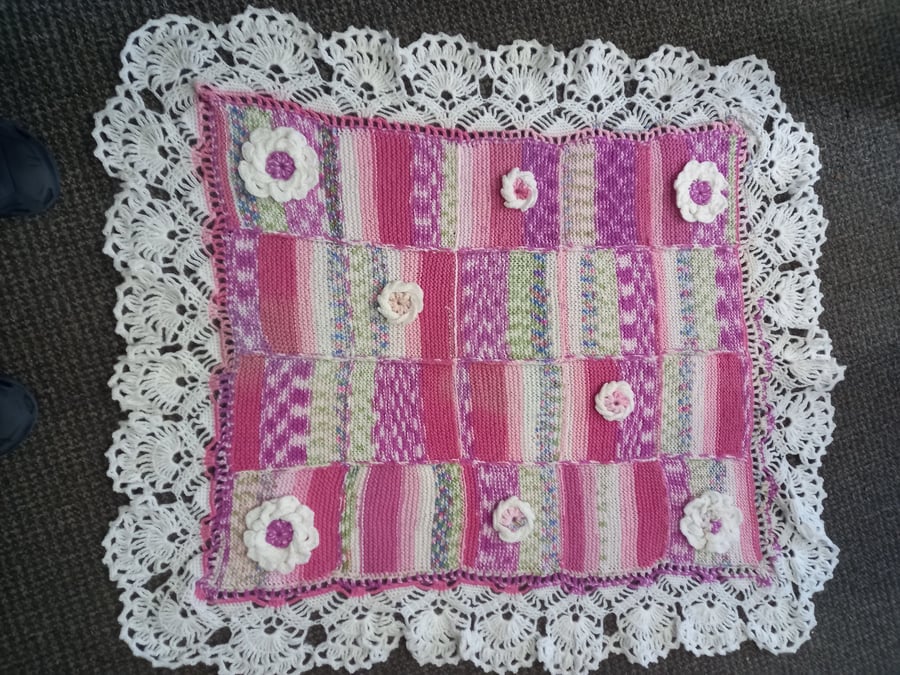 Hand knitted multicolour blanket with flowets