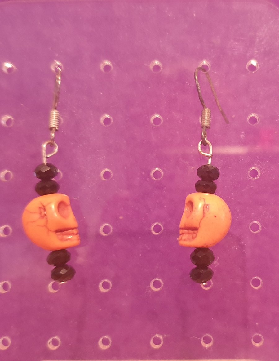 Orange skull earrings