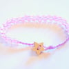 Pink and lilac beaded bracelet with wooden star button.