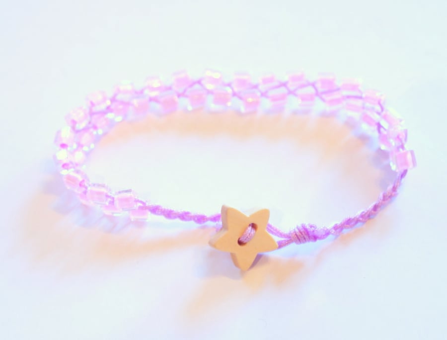 Pink and lilac beaded bracelet with wooden star button.