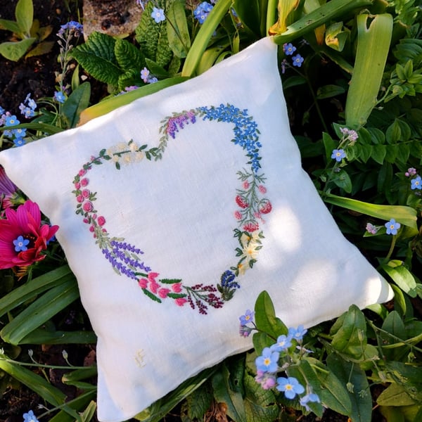 Small heart shaped, hand-embroidered linen cushion filled with lavender