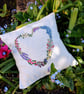 Small heart shaped, hand-embroidered linen cushion filled with lavender