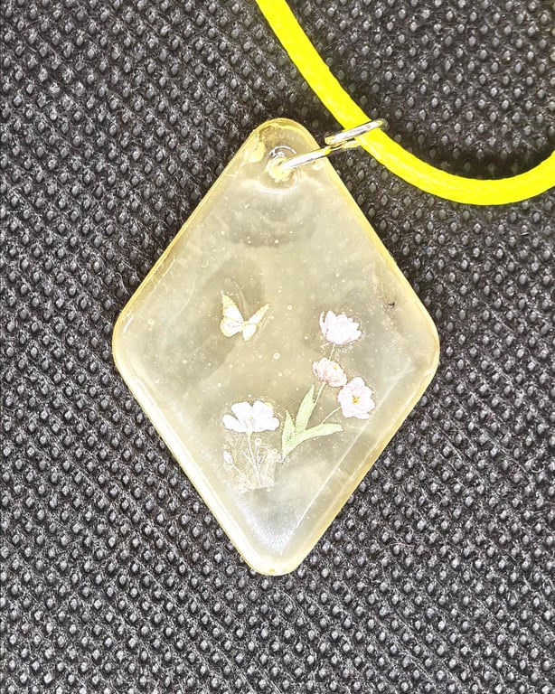 Butterfly Garden Resin Pendant Necklace: Floral, Yellow Cord