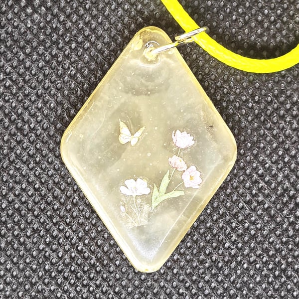 Butterfly Garden Resin Pendant Necklace: Floral, Yellow Cord