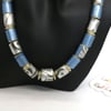 Metallic blue and patterned grey paper beaded necklace on a silver plated chain