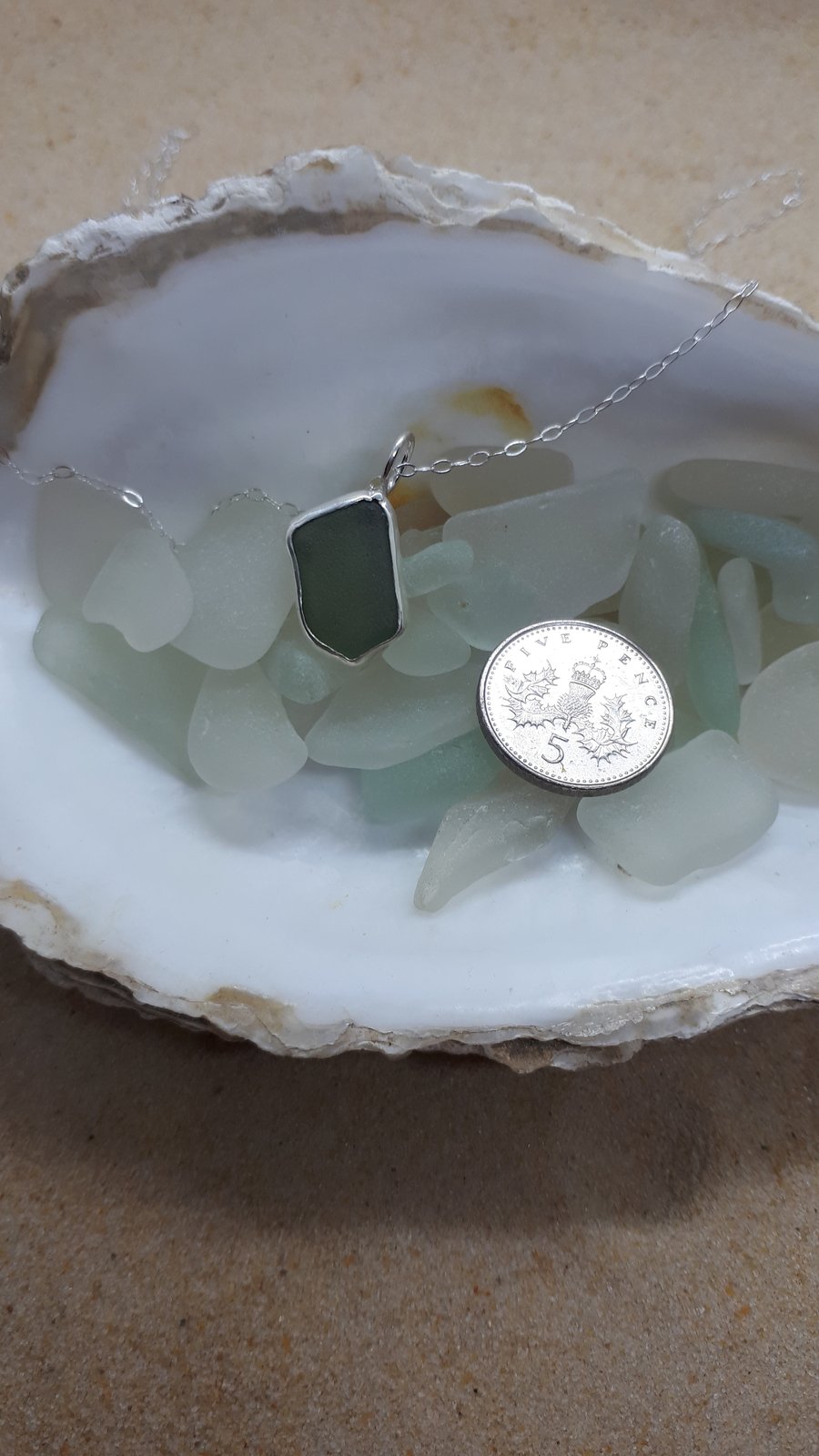 Light olive green sea glass and silver pendant 