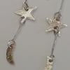 Star and Moon Sterling Silver Drop Earrings made by MidasTouch Jewels in Wales