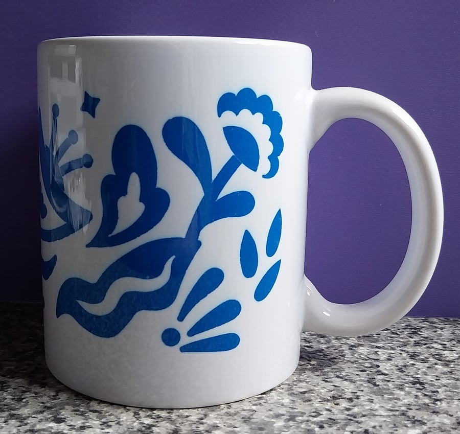 White Ceramic Mug with Blue Flower Design
