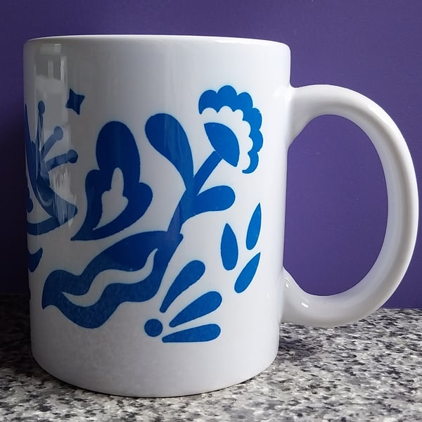 White Ceramic Mug with Blue Flower Design