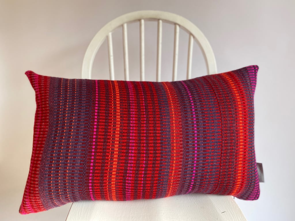 A hand woven 100% wool cushion, designed and made by Yvonne Skelton