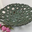 Hand built fruit bowl with interesting green glaze.