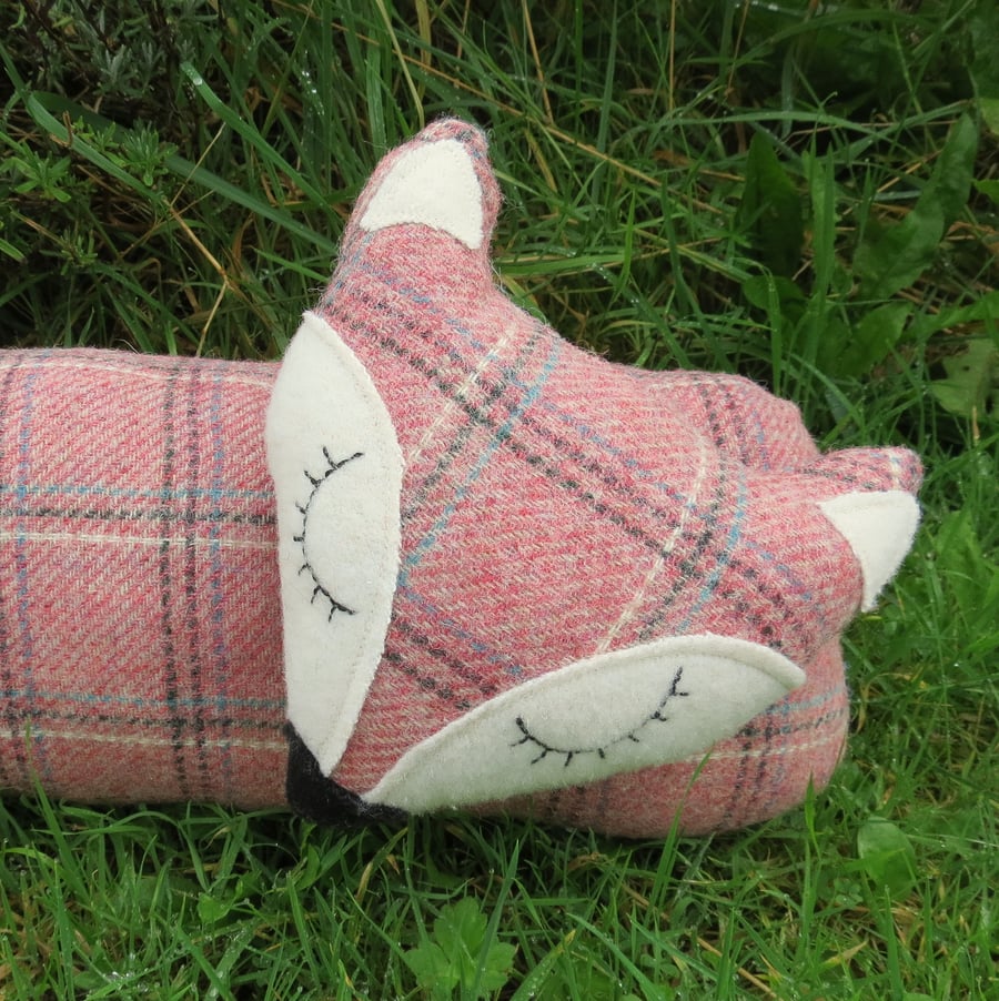 Long fox.  A tartan fox draught excluder.