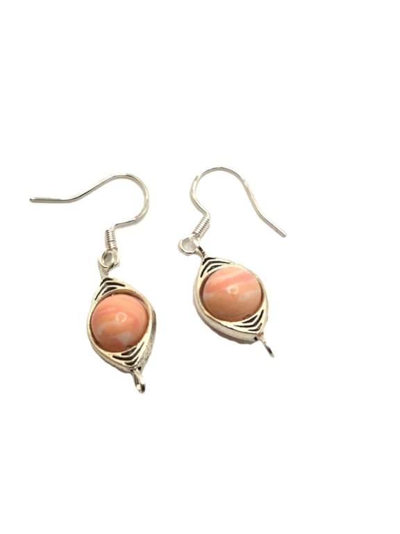 Pair of ladies earrings with Rhodochrosite beads in silvertone connectors