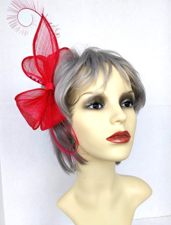 Fuchsia pink bow fascinator with beads and feathers