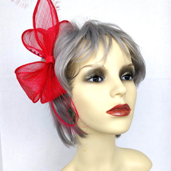 Fuchsia pink bow fascinator with beads and feathers