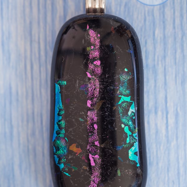 Black fused glass pendant with sparkle stripes in turquoise and pink