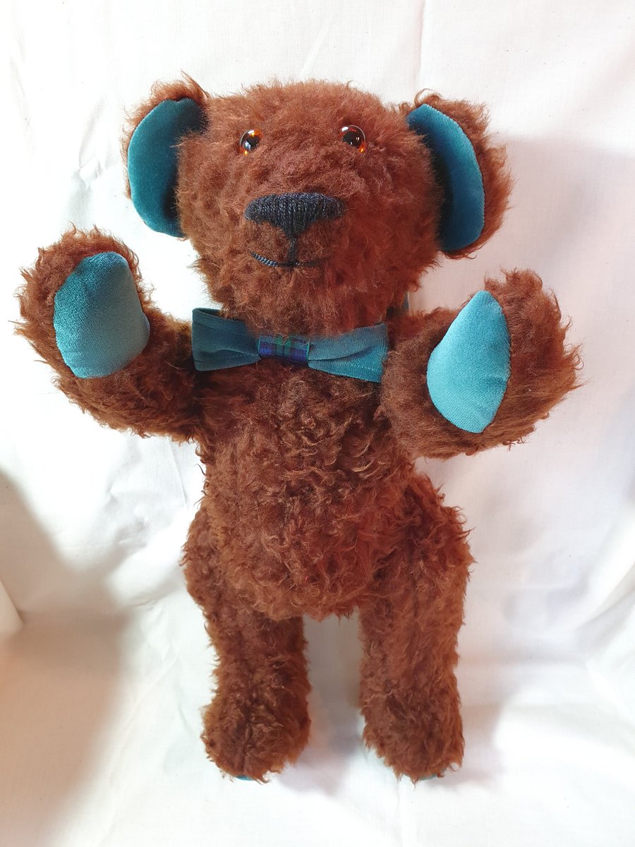 Traditional style handcrafted teddy bear with growler 