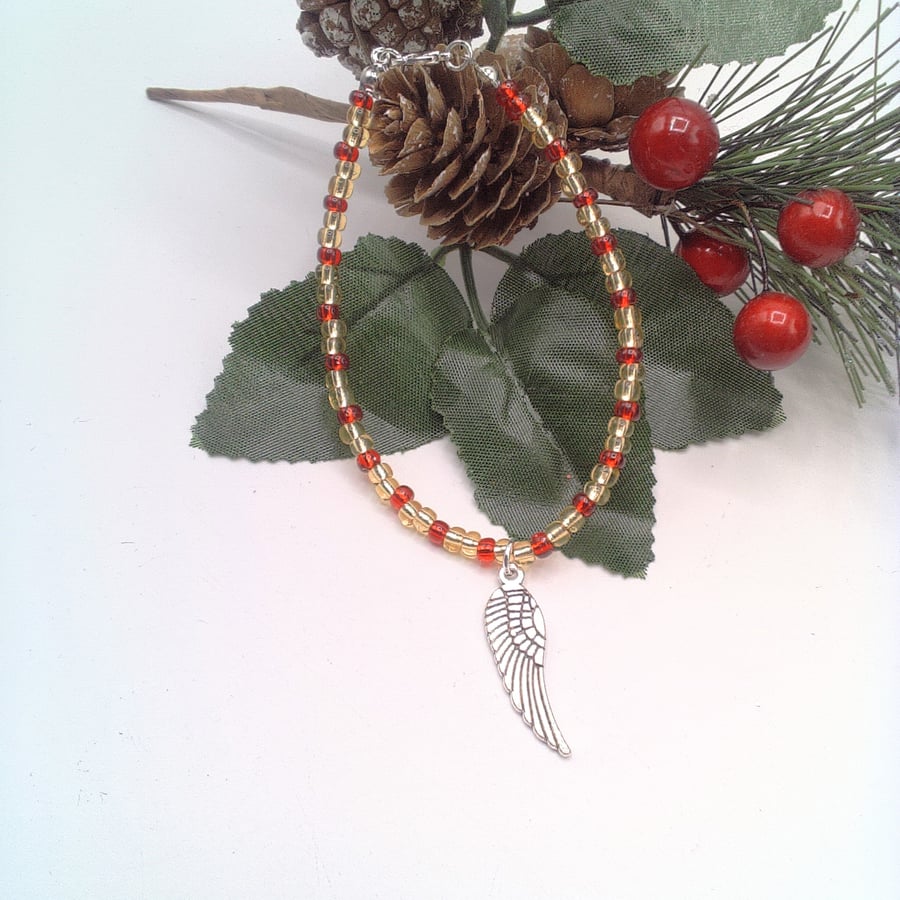 Red and Gold Seed Bead Bracelet with a Silver Plated Angel's Wing Charm 