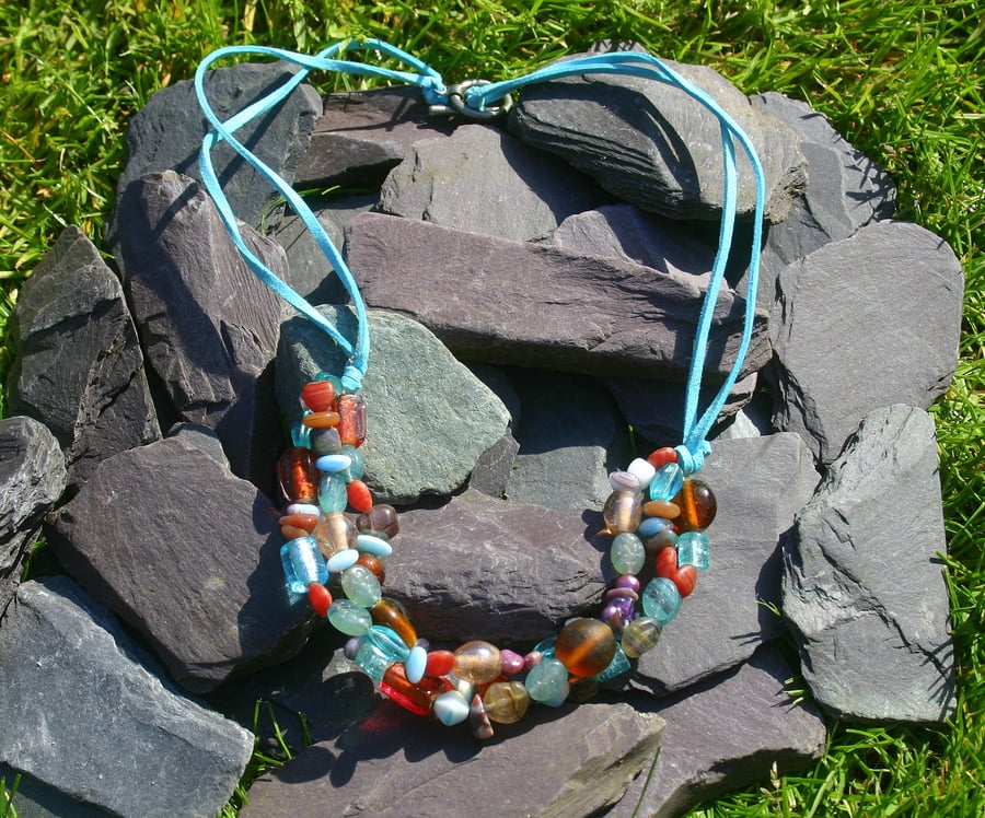 Summery turquoise and red beaded necklace.