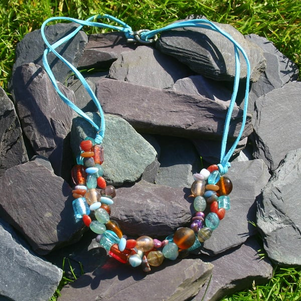 Summery turquoise and red beaded necklace.