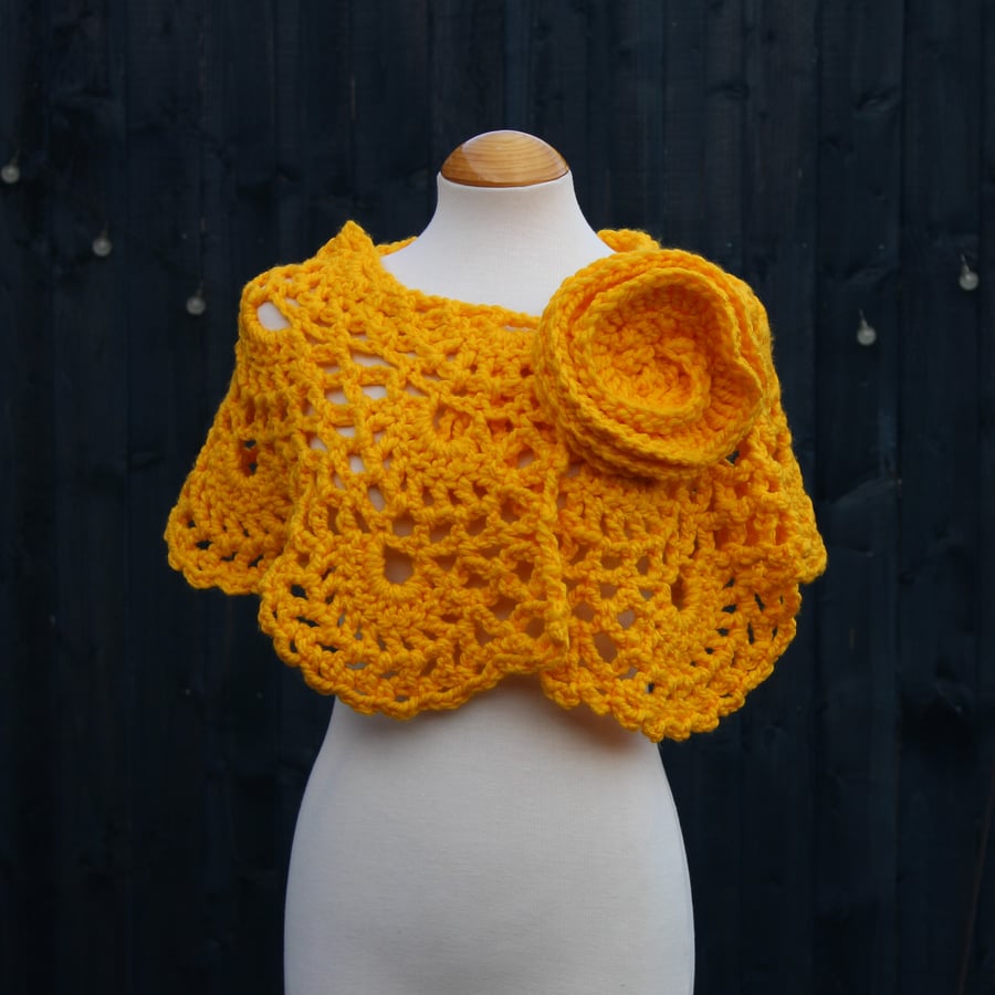 Crochet wrap in mustard yellow acrylic yarn with flower brooch - design SB188