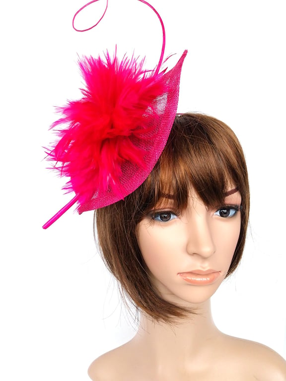 Beautiful fascinator in strong cerise pink with copious feathers and quill