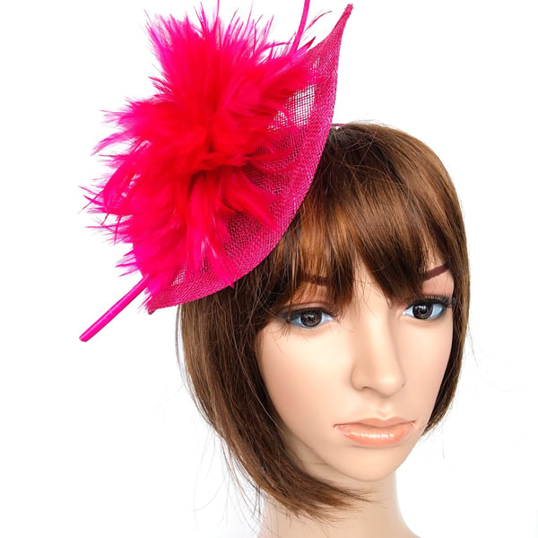 Beautiful fascinator in strong cerise pink with copious feathers and quill