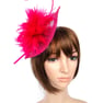 Beautiful fascinator in strong cerise pink with copious feathers and quill