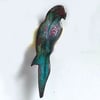 parrot brooch - scrolled red and white on turquoise