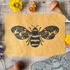 Flower bee lino print on yellow