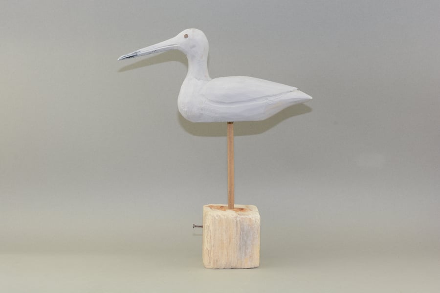 Carved wooden sea bird decoy on driftwood base 
