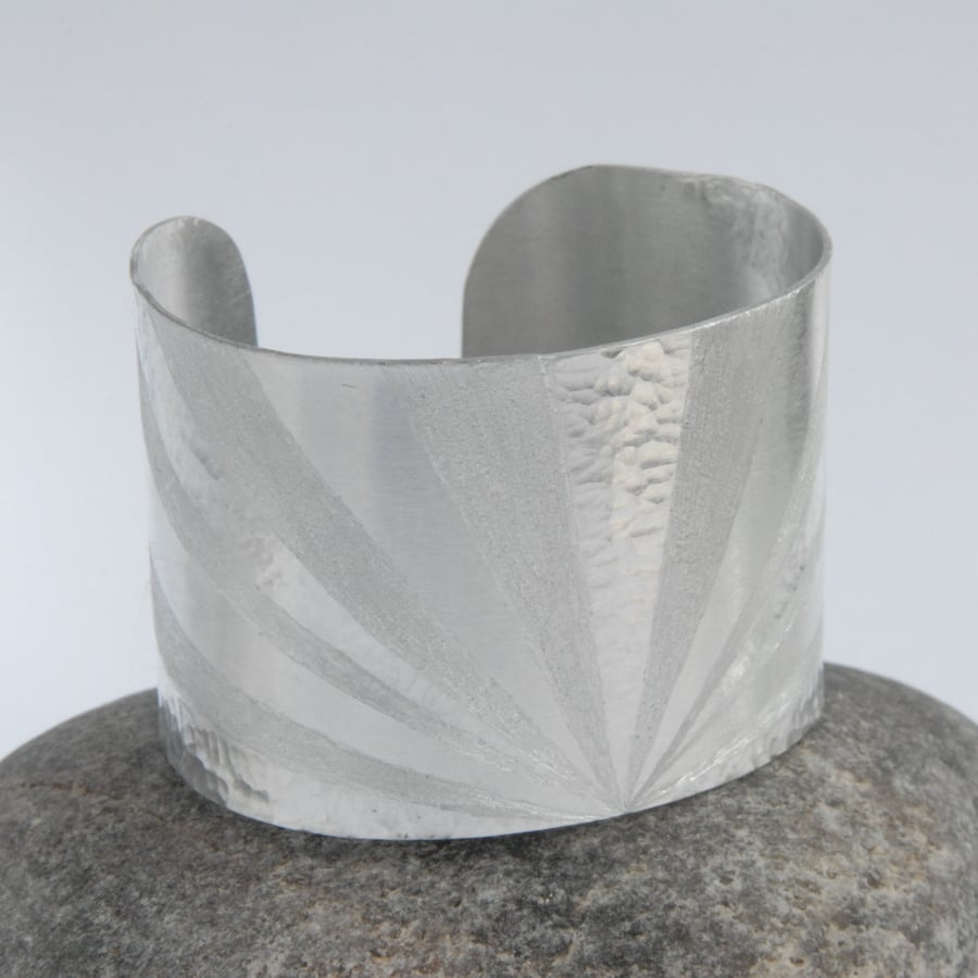 Sun ray textured aluminium cuff