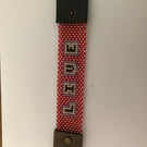 Leather and beadwork bracelet