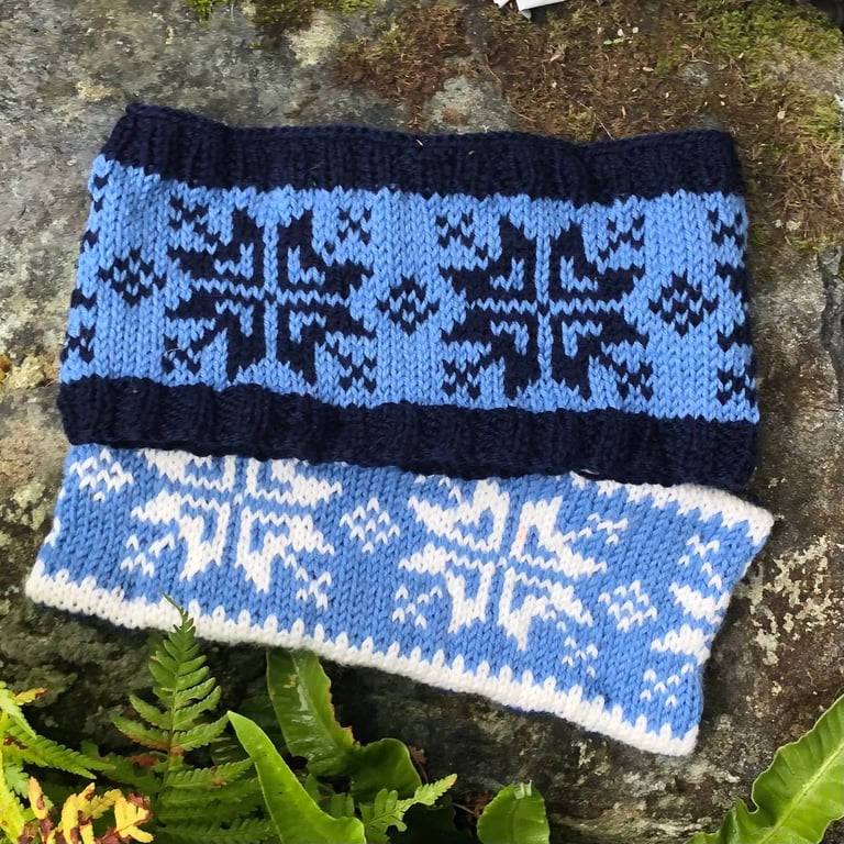 Hand knitted headband featuring Scandinavian snowflake pattern.Fleece lined 
