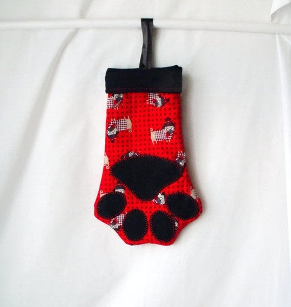 hanging paw shaped christmas stocking for small toys or treats, black lining