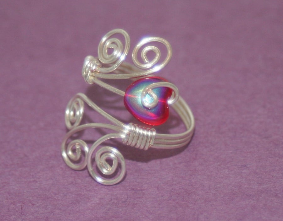 Adjustable wire ring with red heart bead